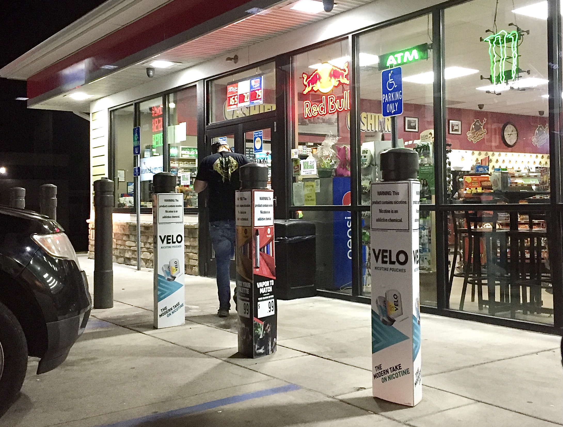 large ads for Velo nicotine pouches outside the store
