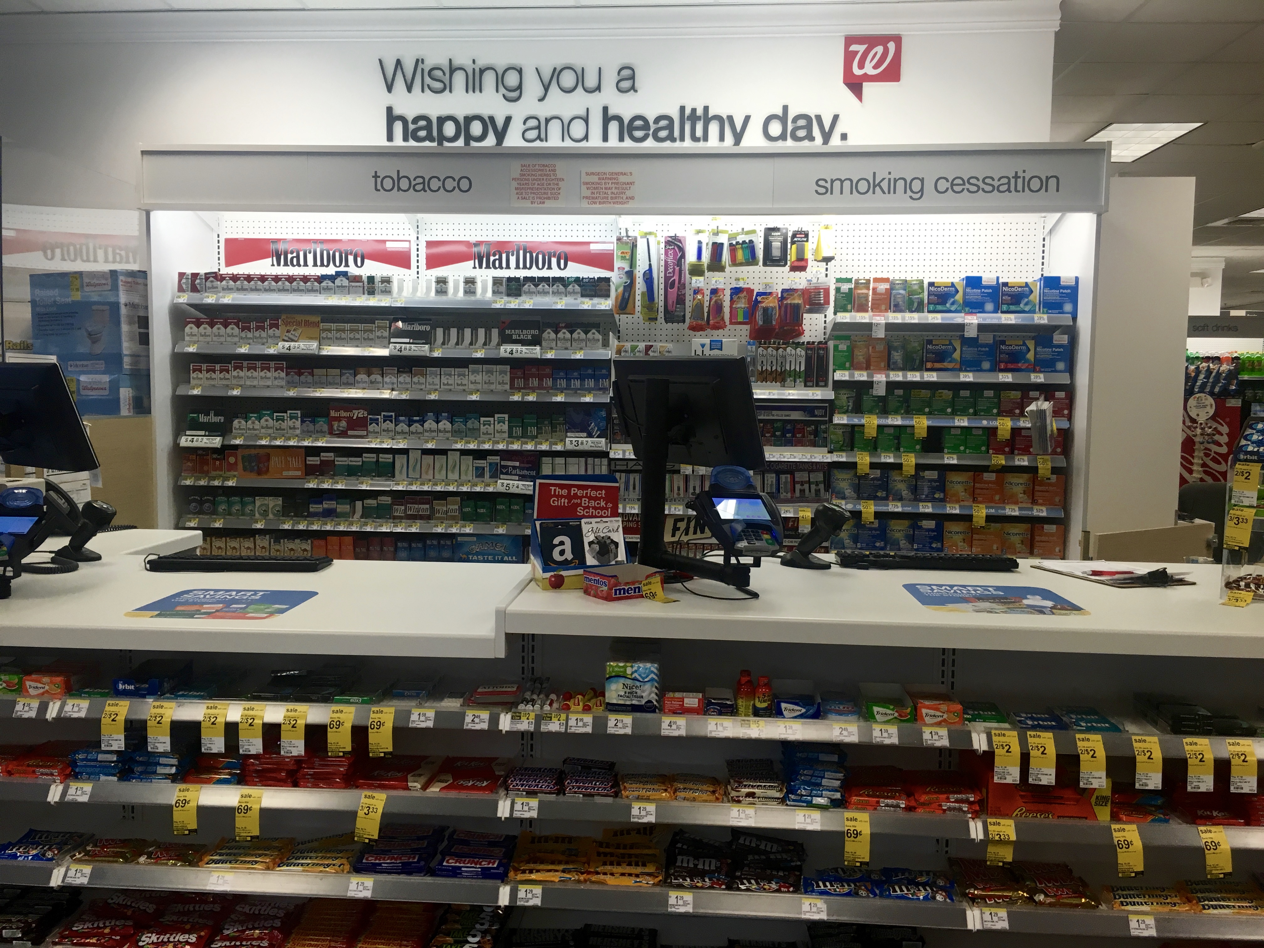 tobacco and cessation products side by side at Walgreens pharmacy