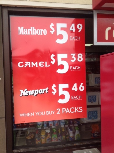 Exterior cigarette advertisements with price