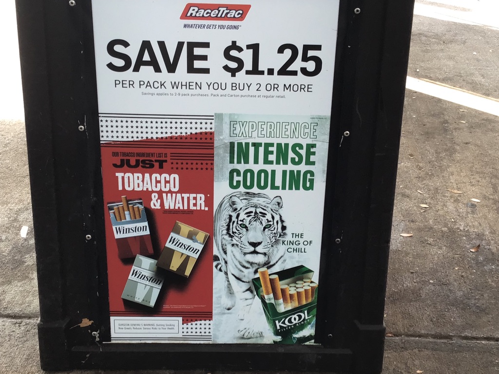 exterior sandwich board ad for Winston and Kool cigarettes 