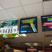 row of ads hanging from the ceiling