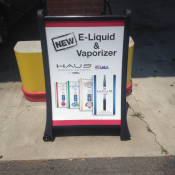 Haus e-liquid and vaporizer ad near gas pump