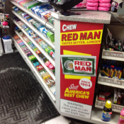 Red Man advertisement near candy display