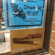 Summer Reading and "Enjoy Black & Mild" posters