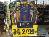 Exterior cigarette product advertising display with price promotion.
