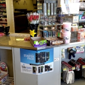 Blu Electronic Cigarettes Advertisement Near Candy in Store Display