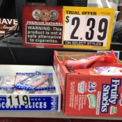 Candy and smokeless tobacco advertisement, together at the register.