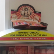 Close Up Toys on Top of Mini Tobacco Display in Pharmacy