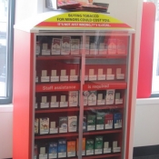 Mini Tobacco Display in a Pharmacy with Toys on Top