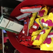 A pack of Virginia Slims inside of a candy bowl that was placed on the sales counter
