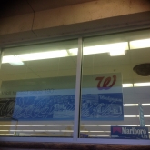 Exterior Marlboro sign in window at Walgreens
