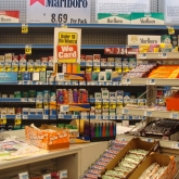 Candy in front of cigarette display