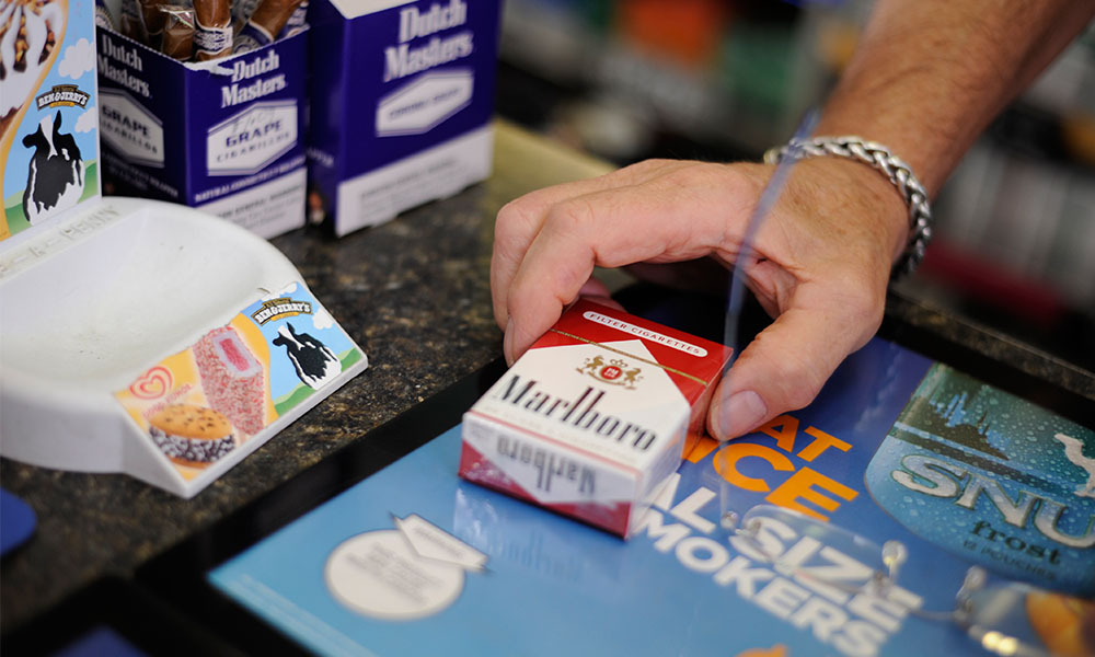Marlboro pack of cigarettes being purchased