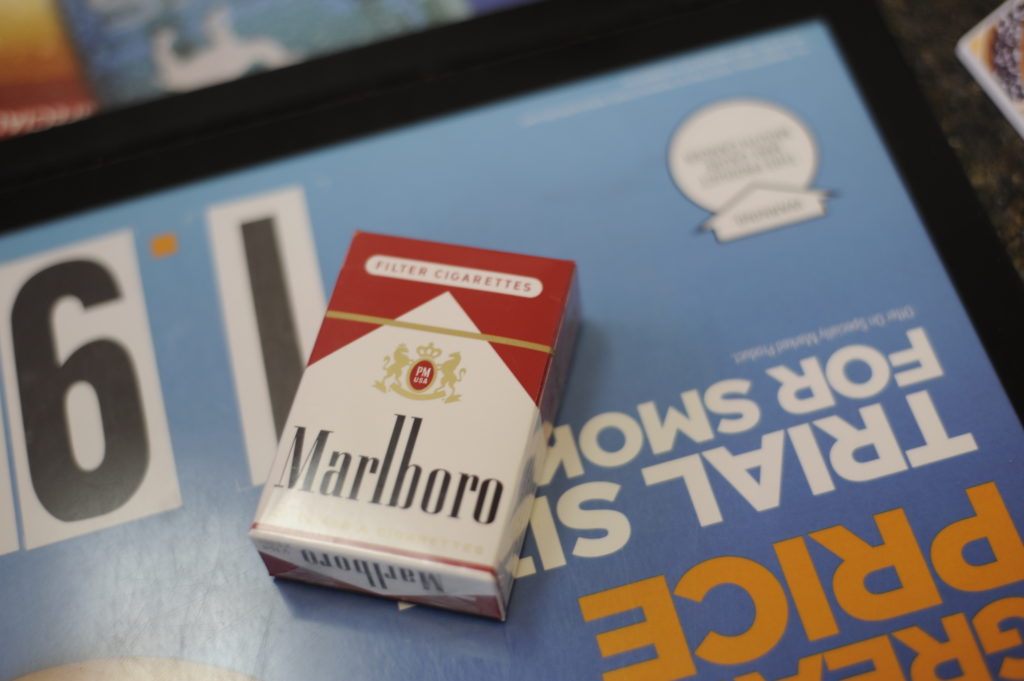 Pack of Red Marlboro cigarettes on retailer counter