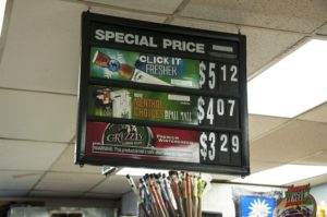 A hanging sign for special prices of menthol cigarettes and snus