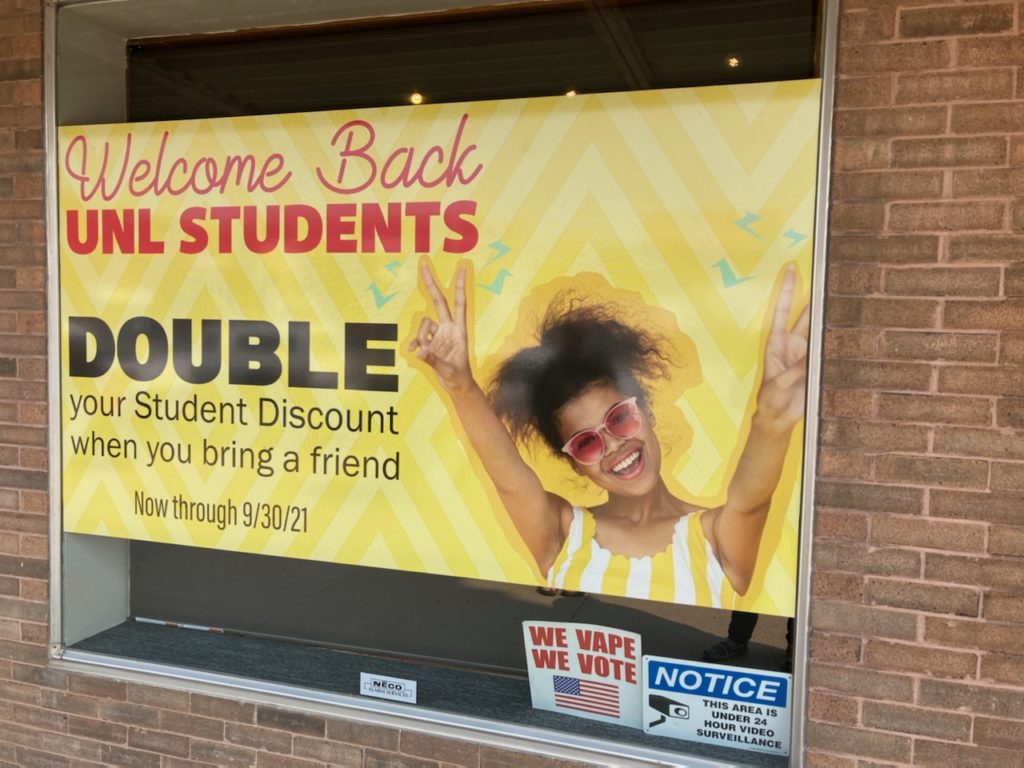 "Welcome Back UNL Students" offering a double discount at a smoke/vape shop