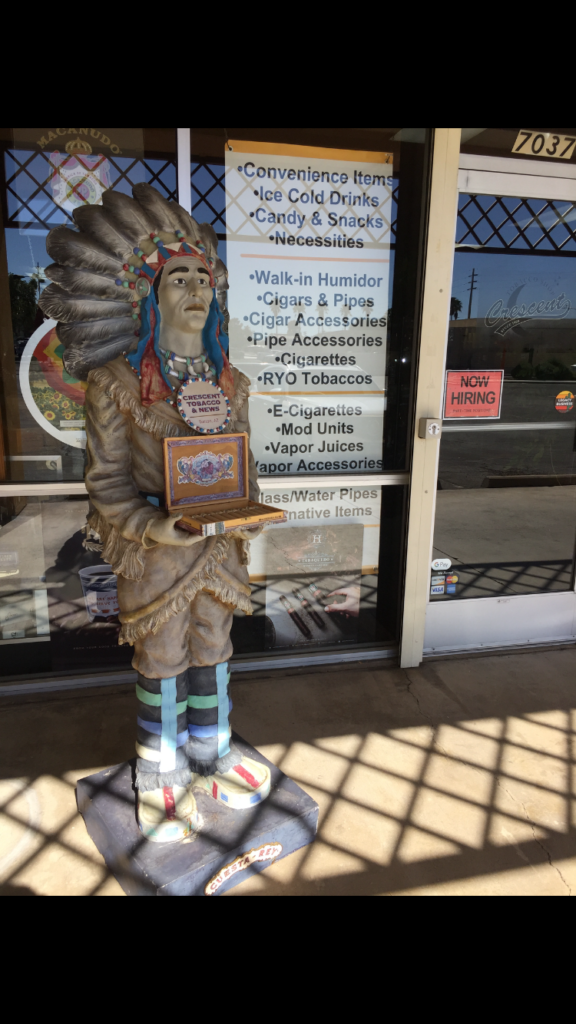 Native American character statue outside a smoke shop 